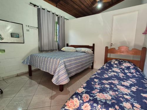 En eller flere senge i et værelse på Summer House in Ubatuba