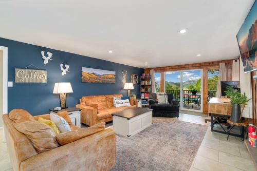 a living room with two couches and a tv at Hot Tub! Pets Ok! Perfect Estes Park Getaway, Walk to Town 3 Kings!#3337 in Estes Park