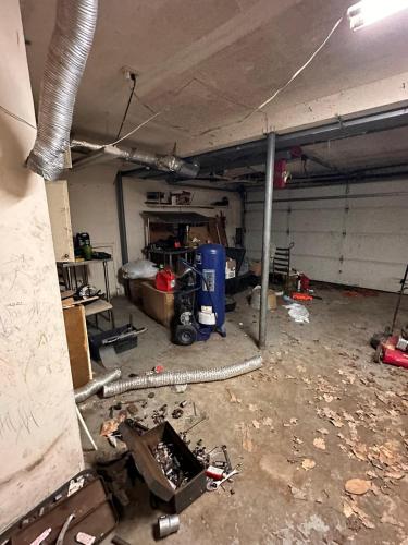 a room with a garage with a lot of tools at Tekoa Duncan Apartments in Northfield