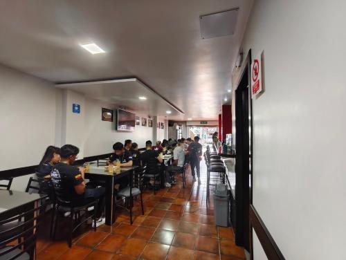 a group of people sitting at tables in a restaurant at Hotel GM Three bed 39 Zamora in Zamora