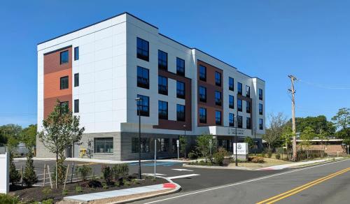 a rendering of an apartment building on a street at 415 Modern Brand New Studio Apartment in East Spotswood
