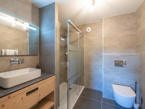 a bathroom with a shower and a sink and a toilet at Appartement moderne, Alpe d'Huez, 6 pers, cosy et pratique - FR-1-645-87 in L'Alpe-d'Huez