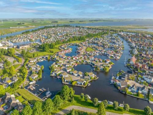 an aerial view of a harbor with houses at Lakeside Villa with Terrace in Delfstrahuizen