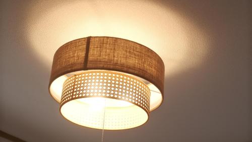 a light hanging from a ceiling at Cozy Nest Sangenjaya 1 Stop to Shibuya ーWalk to Sangenjaya and Ikejiri in Tokyo