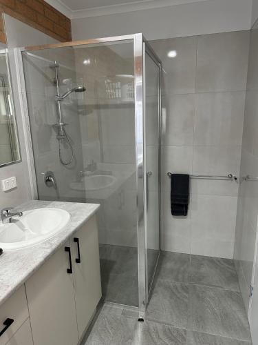 a bathroom with a shower and a sink at LBarza Stylish New One Bedroom Apartment in Shepparton