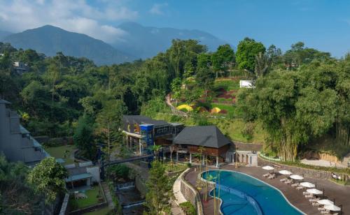 an aerial view of a resort with a swimming pool at Plataran Puncak Suites in Puncak