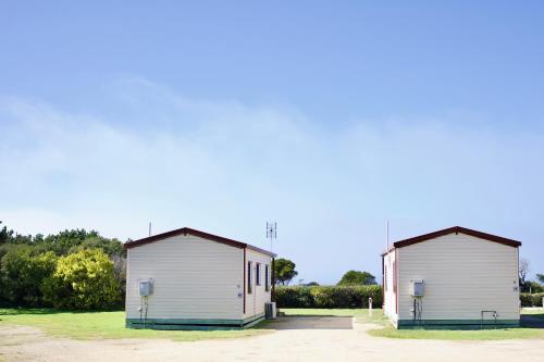 two white buildings sitting next to each other at BIG4 Wilsons Prom Holiday Park in Yanakie