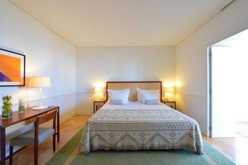 Cama ou camas em um quarto em Pousada da Serra da Estrela
