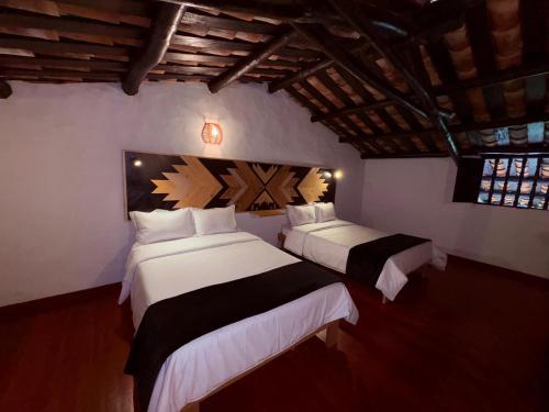 Cama o camas de una habitación en Hotel Hacienda Anacaona - San Agustín