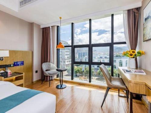 Giường trong phòng chung tại GreenTree Inn Jumang Plaza