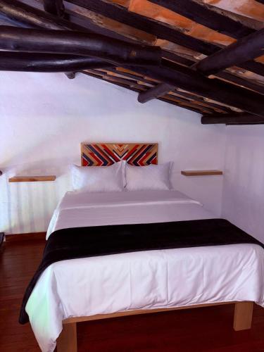 Cama o camas de una habitación en Hotel Hacienda Anacaona - San Agustín