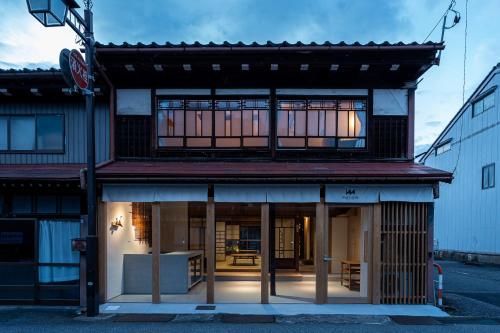 a building with a store front with windows at metate in Kamiichi