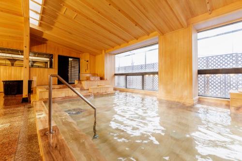 a large room with a pool of water at Ooedo Onsen Monogatari Yamashiro Saichoraku in Kaga