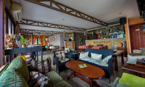 a living room with couches and a table at San Art Floating Hostel & Apartments in Belgrade