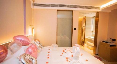a room with a bed with some food on it at Lavande Hotel Shenzhen East Gate Wanxiang City Guomao Metro Statipn in Shenzhen