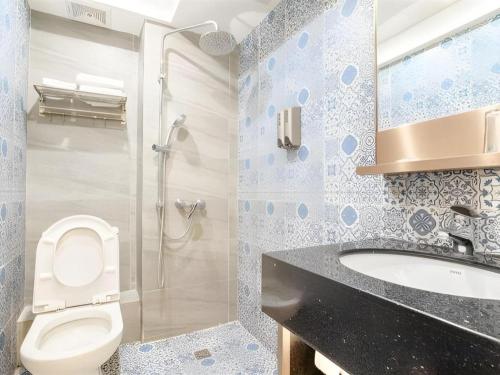 Ein Badezimmer in der Unterkunft Hou Kong Hotel