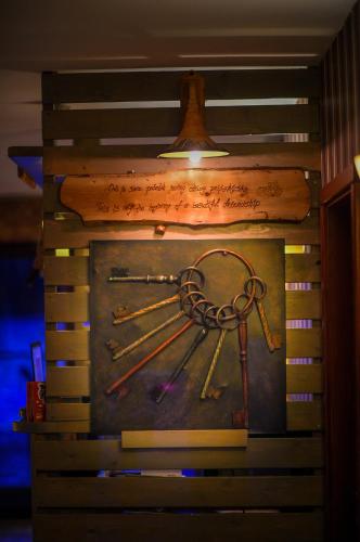 a painting of a bunch of keys on a wall at San Art Floating Hostel & Apartments in Belgrade