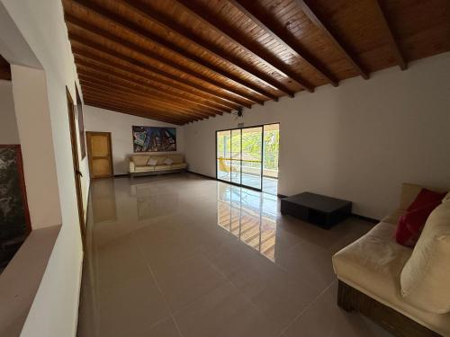 a living room with a couch and a table at Hotel Selva Cristal in San Carlos