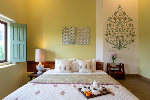 Postel nebo postele na pokoji v ubytování Mukam at Kanak Vilas, Jaipur