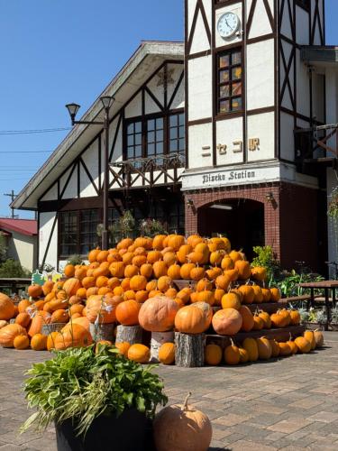 a large pile of oranges in front of a building at GraceNiseko in Niseko
