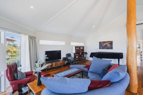 a living room with a couch and chairs and a television at Peppy Harmony House - Coastal Calm on Geographe Bay in Capel