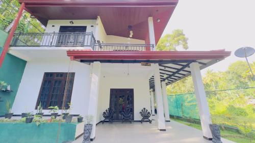 a view of a house with a balcony at Hill Top Villa in Ambatenna