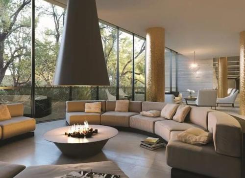 a living room with a large couch and a table at Grand Bayview Corporate Residency in Melbourne