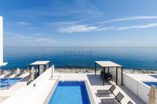 Elegant 4BR Villa with Arabian Gulf, Mountain and Community Views, Assistant Room and Heated Pool, Al Dana Island, Fujairah by Deluxe Holiday Homes