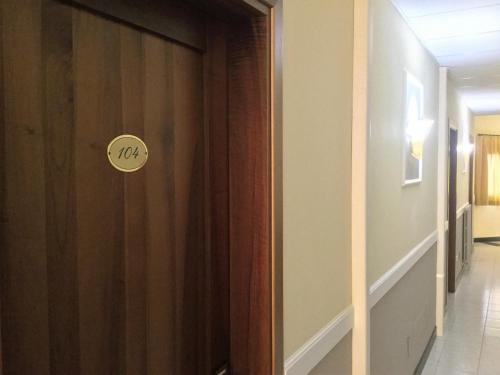 a door with the number on it in a hallway at Hotel Marco Polo SELF CHECK-IN in Bologna