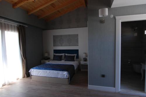 Alaçatı The Design Hotelにあるベッド