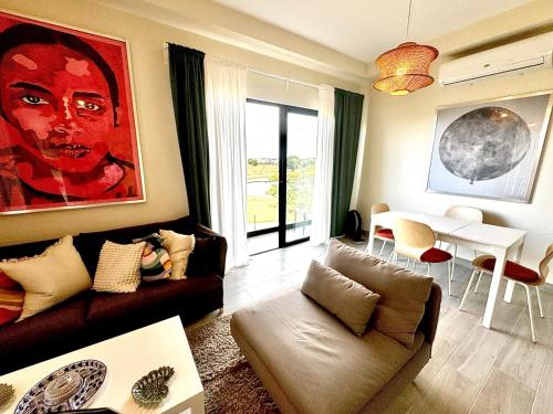 a living room with a couch and a table at Family paradise in Punta Cana in Punta Cana
