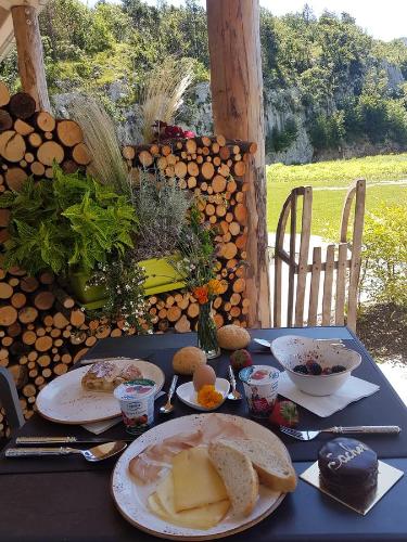 a blue table with plates of food on it at Agritur La Dolce Mela - Adults Only in Vezzano