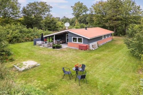 an aerial view of a house with a table and chairs at JB162-Fjerritslev-Ronnevej-4 in Fjerritslev