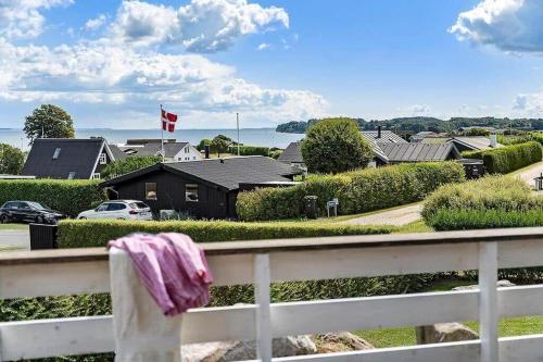 a white fence with a pink towel hanging on it at SJ301-Hejls-Teglgardsvej-3 in Hejlsminde