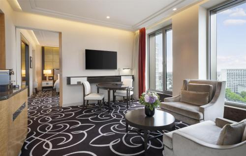 a hotel suite with a living room at Waldorf Astoria Berlin in Berlin