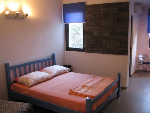 Ένα ή περισσότερα κρεβάτια σε δωμάτιο στο Apartman Buljarica