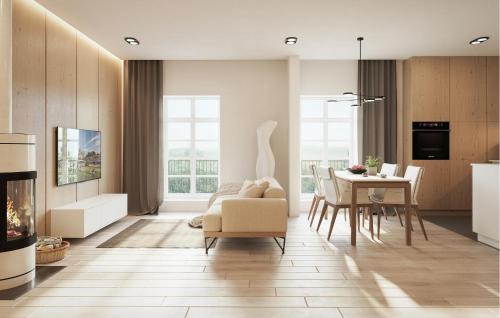 ein Wohnzimmer mit einem Tisch, einem Stuhl und einem Sofa in der Unterkunft Apartment Imenau in Bad Frankenhausen