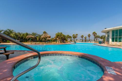 a swimming pool at a resort at Caribe 213B in Orange Beach