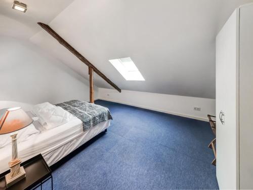a bedroom with a bed and a table with a lamp at Sevenig Our Family Farmhouse in Sevenig