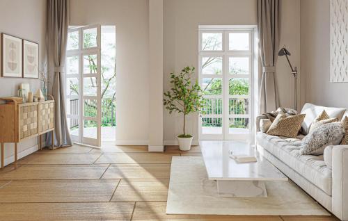 a living room with a couch and a table at Schiller Suite in Bad Frankenhausen