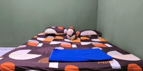 Ένα ή περισσότερα κρεβάτια σε δωμάτιο στο Green House Homestay