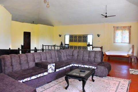 a living room with a couch and a coffee table at Kasuku villa in Ukunda