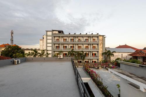 a view of a building from the rooftop of a building at SNUG Kuta in Kuta