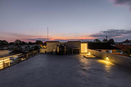 a view of the rooftop of a building at sunset at SNUG Kuta in Kuta