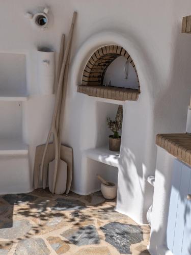 a kitchen with an archway in the corner of a room at Villa Maira with Seaview and Private Swimming Pool in Drios