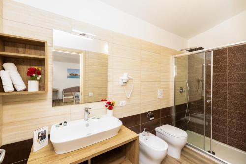 a bathroom with a sink and a toilet and a shower at Detached villa with 2 bathrooms in Lupetto
