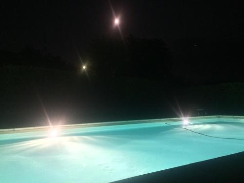 two lights on a tennis court at night at Cascina Filipot in Cerretto Langhe