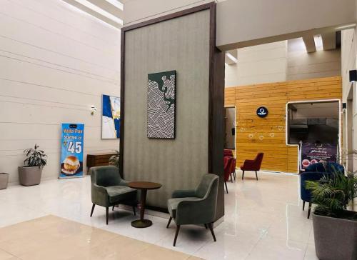 a waiting room with chairs and a table in a building at TheDreamystay dreamy Balcony View in Greater Noida