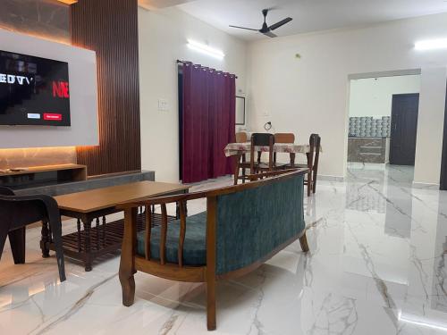 a dining room with a table and chairs at Pondicherry homestay - beach house 8 to 10 people in Kottakupam