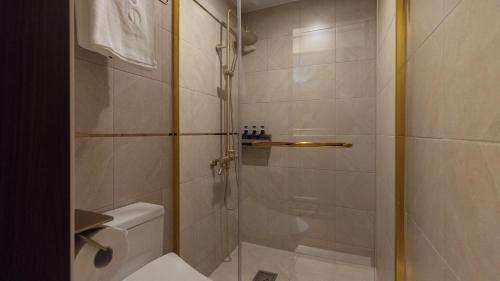 a bathroom with a shower and a toilet at Stay Passport Express Gyeongseong Cheongnyangni in Seoul